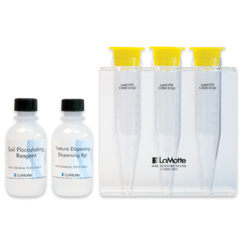 Two labeled reagent bottles and three clear, upright plastic test tubes with yellow caps are displayed. The tubes are held in a transparent stand labeled LaMotte Soil Texture Stand, part of the Soil Texture Test - 1067 kit.