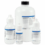 Four bottles of Phenolphthalein Indicator 1% solution from LaMotte, a titration reagent for alkalinity, in different sizes arranged on a white background. Each bottle features a white cap and blue-and-white label.