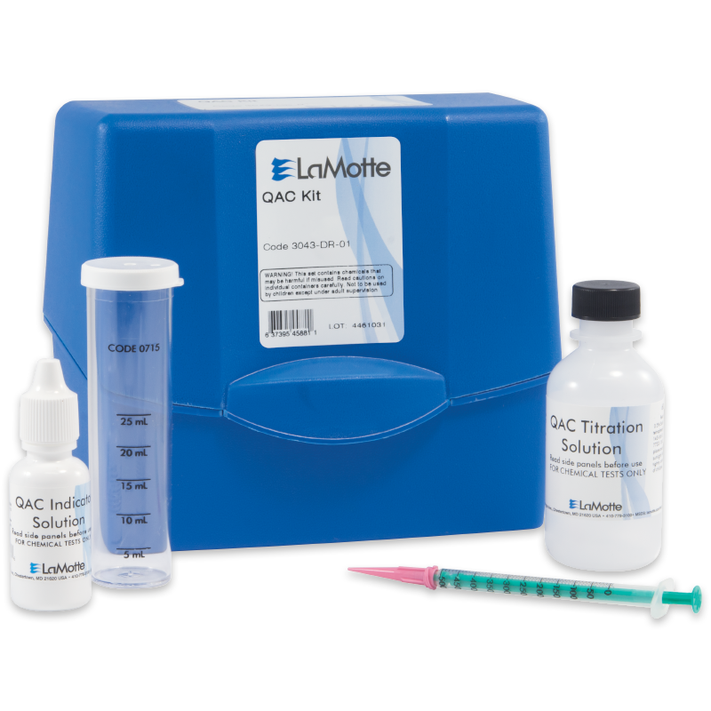 A blue LaMotte QAC Test Kit - 3043-DR-01 box with a graduated cylinder, a small dropper bottle labeled “QAC Indicator Solution,” a larger bottle labeled “QAC Titration Solution,” and a green-tipped syringe.