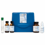 The Detergent Test Kit - 4507-02 features a blue plastic case, glass test tube, two brown reagent bottles, a jar of pH adjustment powder, and a small white bottle—each clearly labeled for chemical testing.