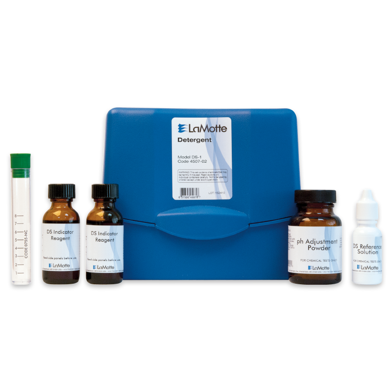 The Detergent Test Kit - 4507-02 features a blue plastic case, glass test tube, two brown reagent bottles, a jar of pH adjustment powder, and a small white bottle—each clearly labeled for chemical testing.