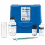 A blue LaMotte Total Alkalinity Test Kit - 4533-DR-01 case with alkaline titration bottle, BCG-MR and phenolphthalein tablets, a clear measuring tube, and syringe, used for accurate alkalinity testing.