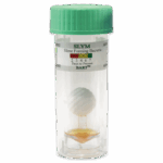 A clear plastic vial with a green lid, containing a ball on a stick and orange liquid at the bottom. The label reads Slime Forming Bacteria - SLYM-BART - 5-0026 with a color-coded chart and days-to-present indicator.