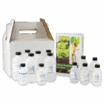 A set of plastic bottles with scientific labels is arranged next to a booklet titled Plant Nutrition Studies - 5940. A white cardboard carrying case with a handle is positioned behind the items.