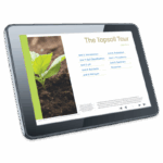 A tablet displays an educational presentation titled Topsoil Tour - 5973-01, featuring a menu of soil-related units and a photo of a young green plant sprouting from dark soil.
